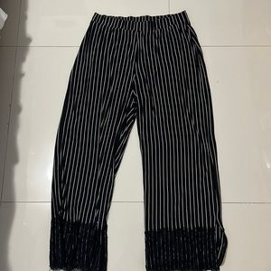 Black and white striped pants with black lace at ends